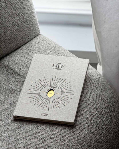 Life Designer Journal for Couples by Intelligent Change, open with pages showing prompts and space for shared reflections.