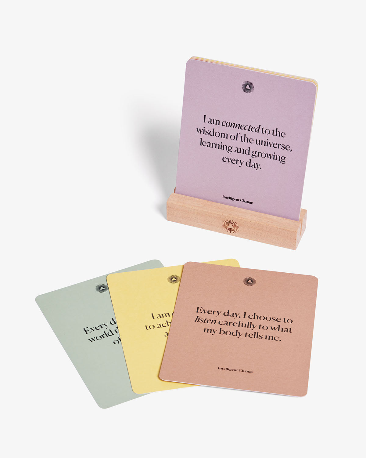 A set of mindful affirmations for chakra balancing by Intelligent Change, featuring calming, positive messages on a serene background.