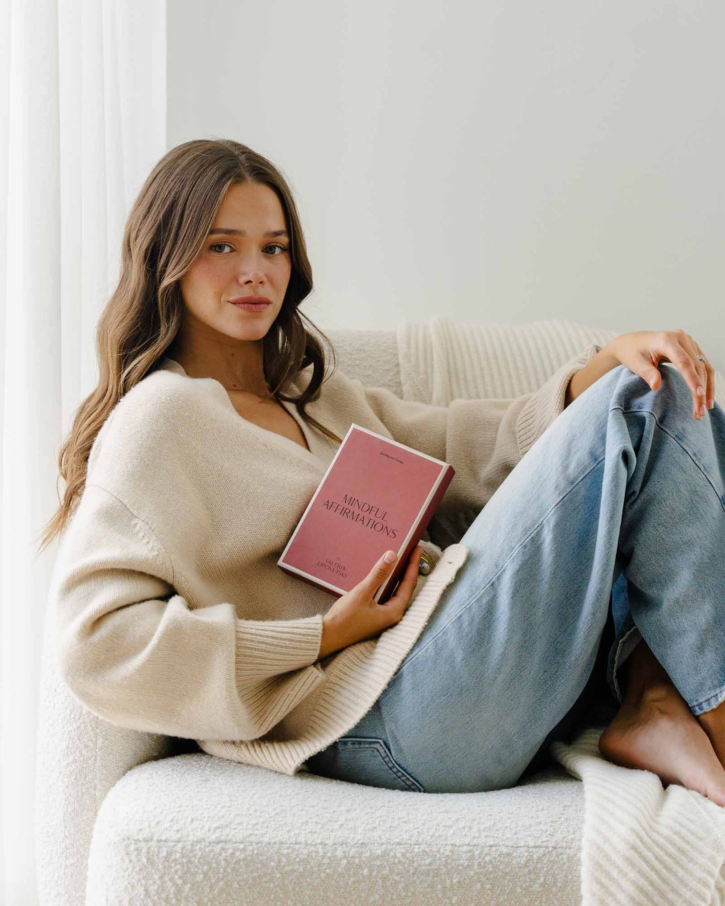 A book titled "Mindful Affirmations for Women" by Valeria Lipovetsky from Intelligent Change, featuring a soft, calming cover design.