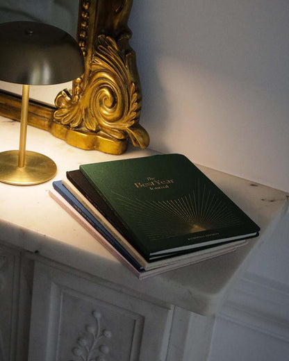 Green Best Year Journal Essential by Intelligent Change for mindfulness, featuring a closed journal with a minimalist cover design.