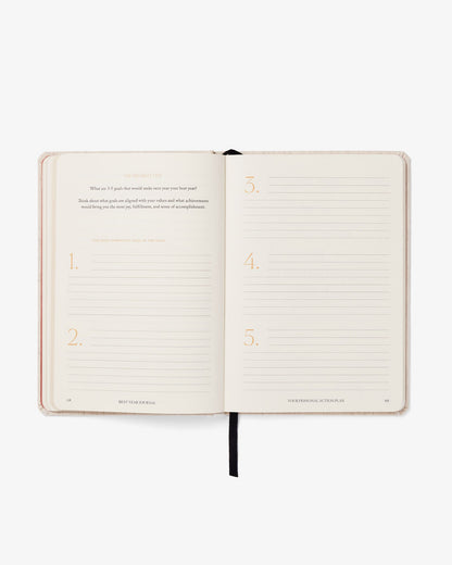 Pink Best Year Journal by Intelligent Change, a mindfulness journal with a soft cover and inspiring prompts for reflection.