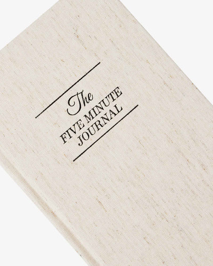 The Five Minute Journal - Original Linen by Intelligent Change, a mindfulness journal with a textured linen cover and guided prompts inside.