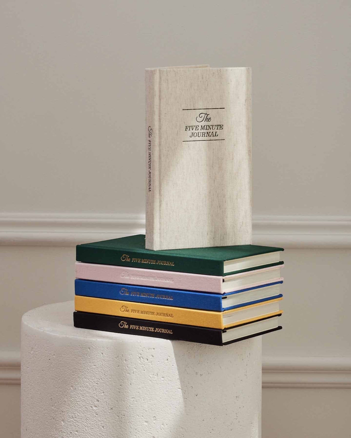 The Five Minute Journal Original Linen by Intelligent Change, a mindfulness journal with a durable linen cover and motivational prompts.