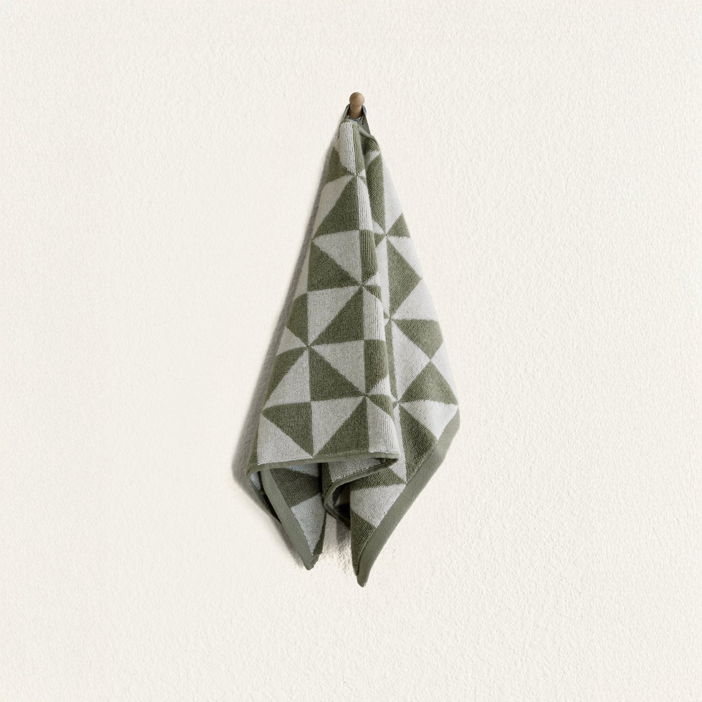 Set of two Italic Umbra Australian cotton bath towels in sage and ecru, soft and absorbent for home use.