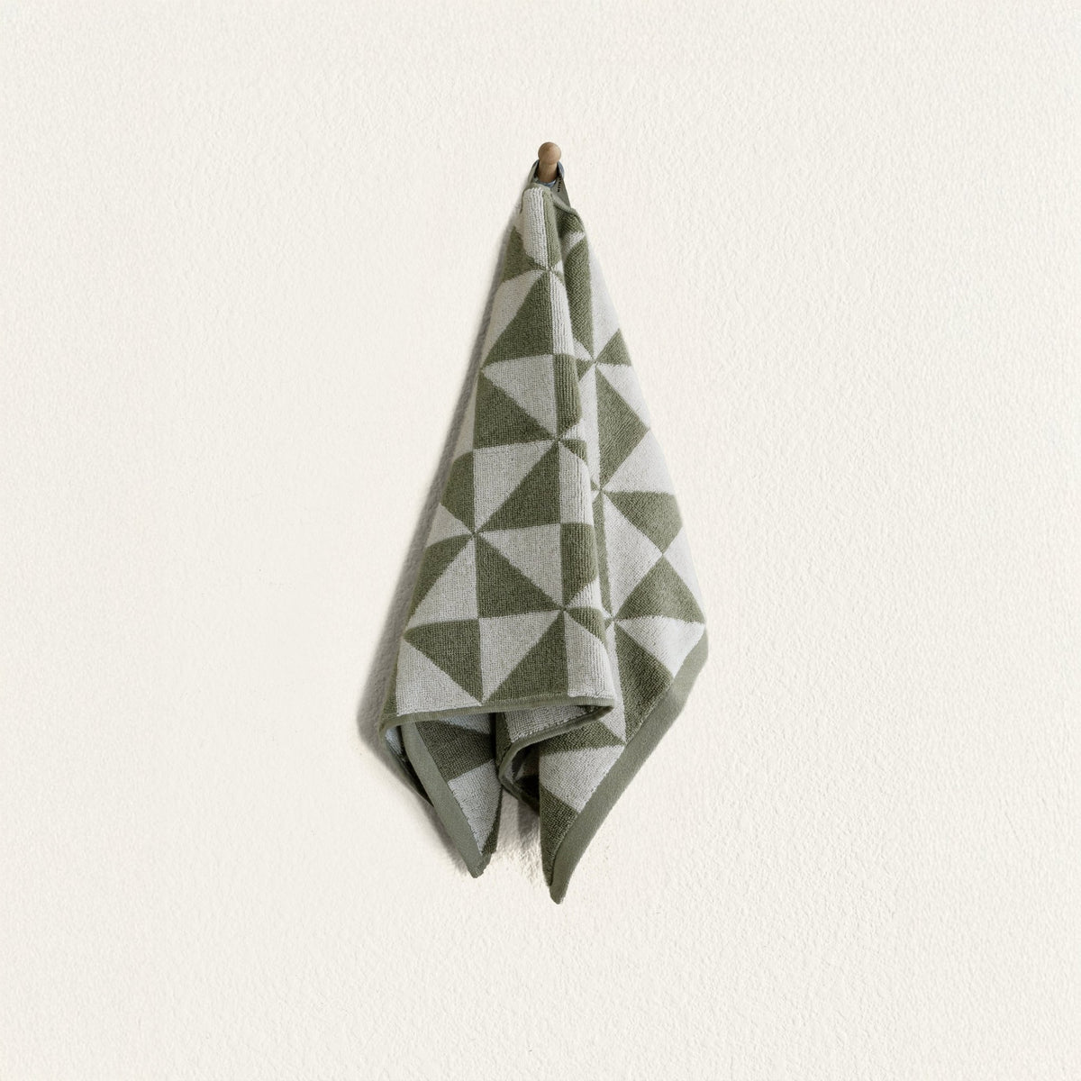 Set of two Italic Umbra Australian cotton bath towels in sage and ecru, soft and absorbent for home use.
