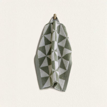Set of two Italic Umbra Australian cotton bath towels in sage and ecru, soft and absorbent for home bath use.