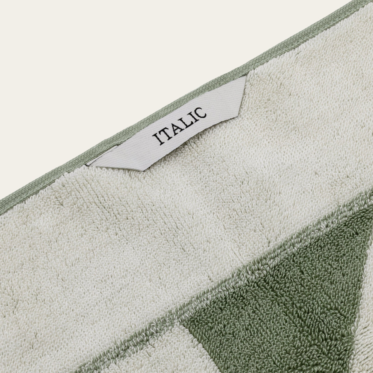 Set of two Italic Umbra Australian Cotton Bath Towels in sage and ecru, soft and plush for home bathroom use.
