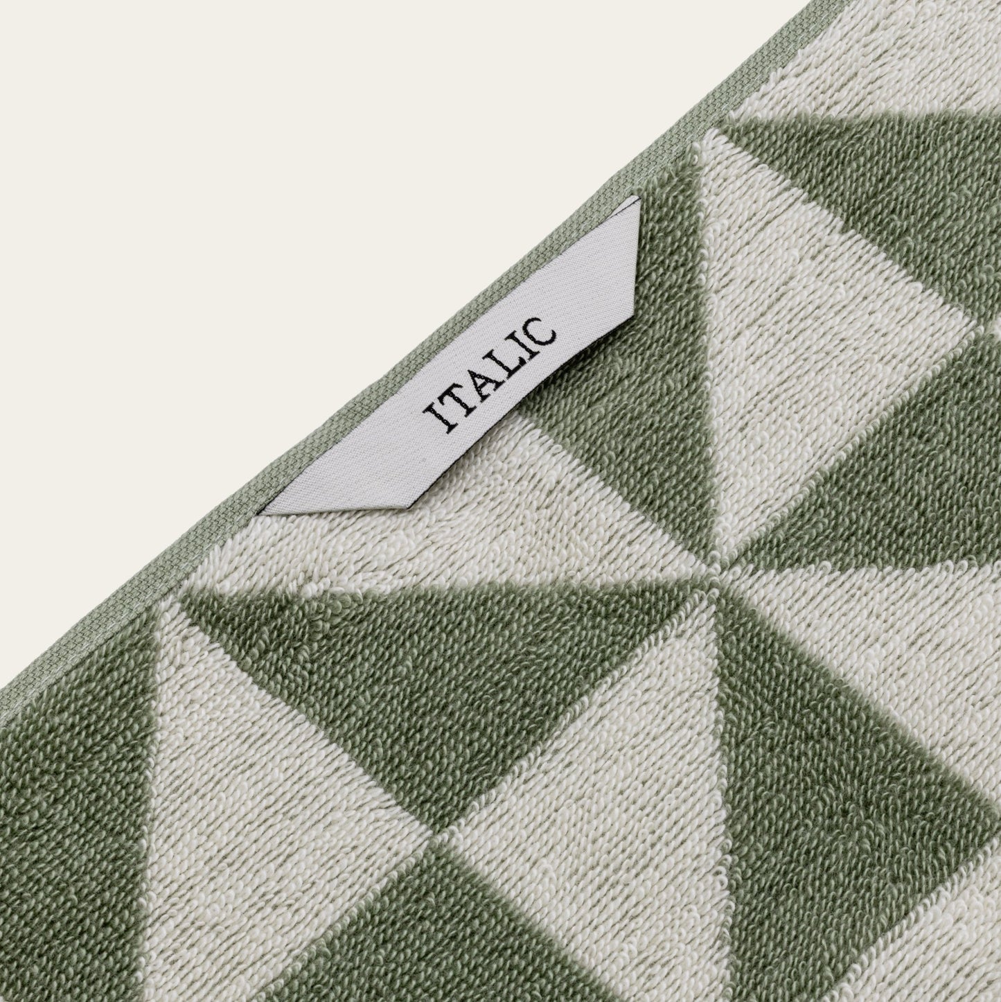 Set of two Italic Umbra Australian Cotton Bath Towels in sage and ecru, soft, plush, and perfect for home bathroom use.