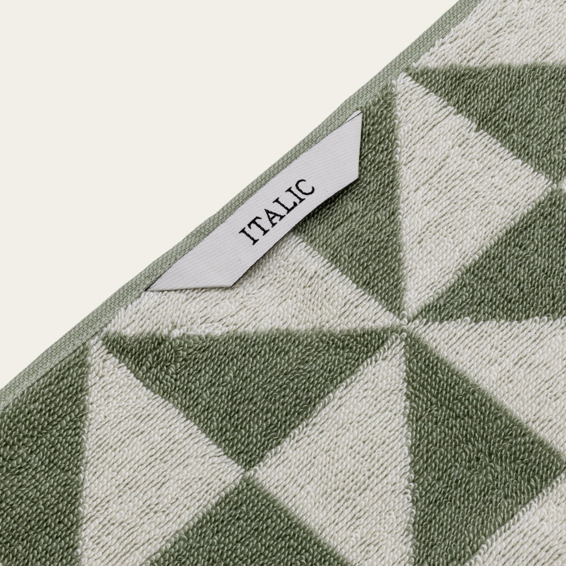Set of two Italic Umbra Australian Cotton Bath Towels in sage and ecru, soft, plush, and perfect for home bathroom use.