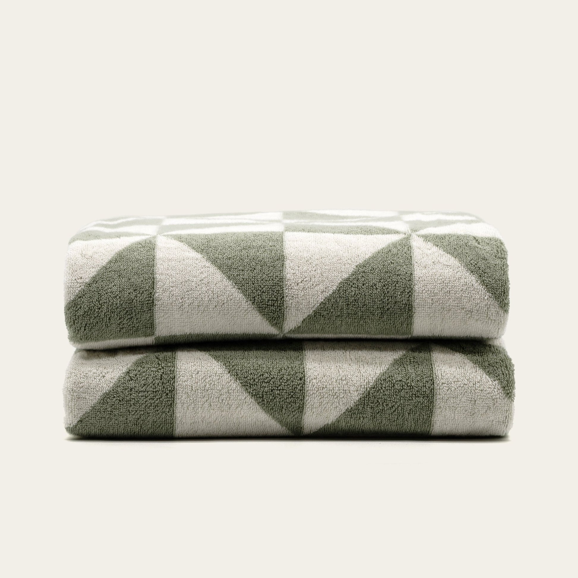 Set of two Italic Umbra Australian Cotton Bath Towels in sage and ecru, soft and plush for home use.