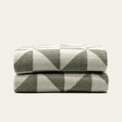 Set of two Italic Umbra Australian Cotton Bath Towels in sage and ecru, soft and plush for home use.