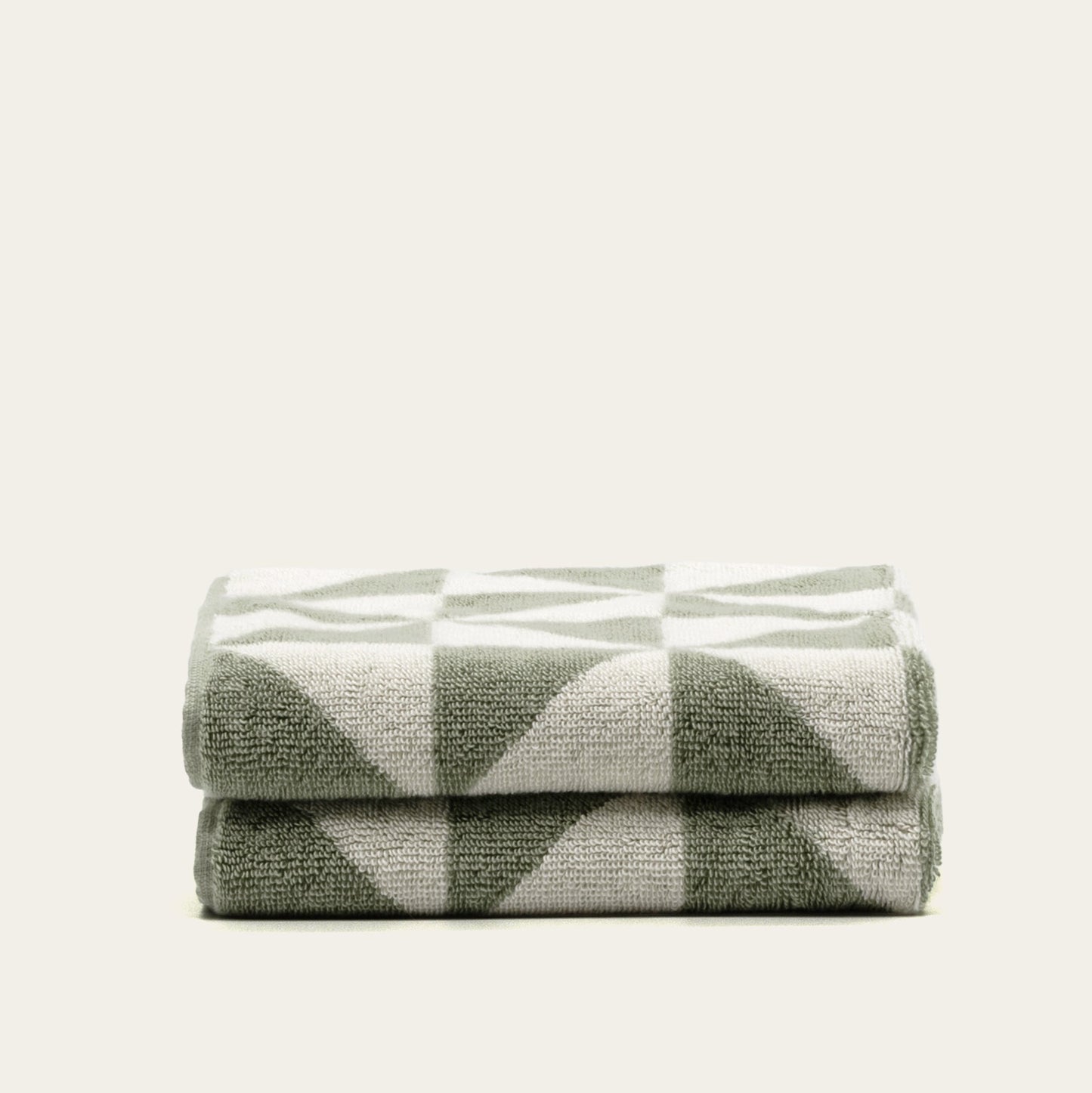 Set of two Italic Umbra Australian cotton bath washcloths in sage and ecru, soft and absorbent for home bath use.