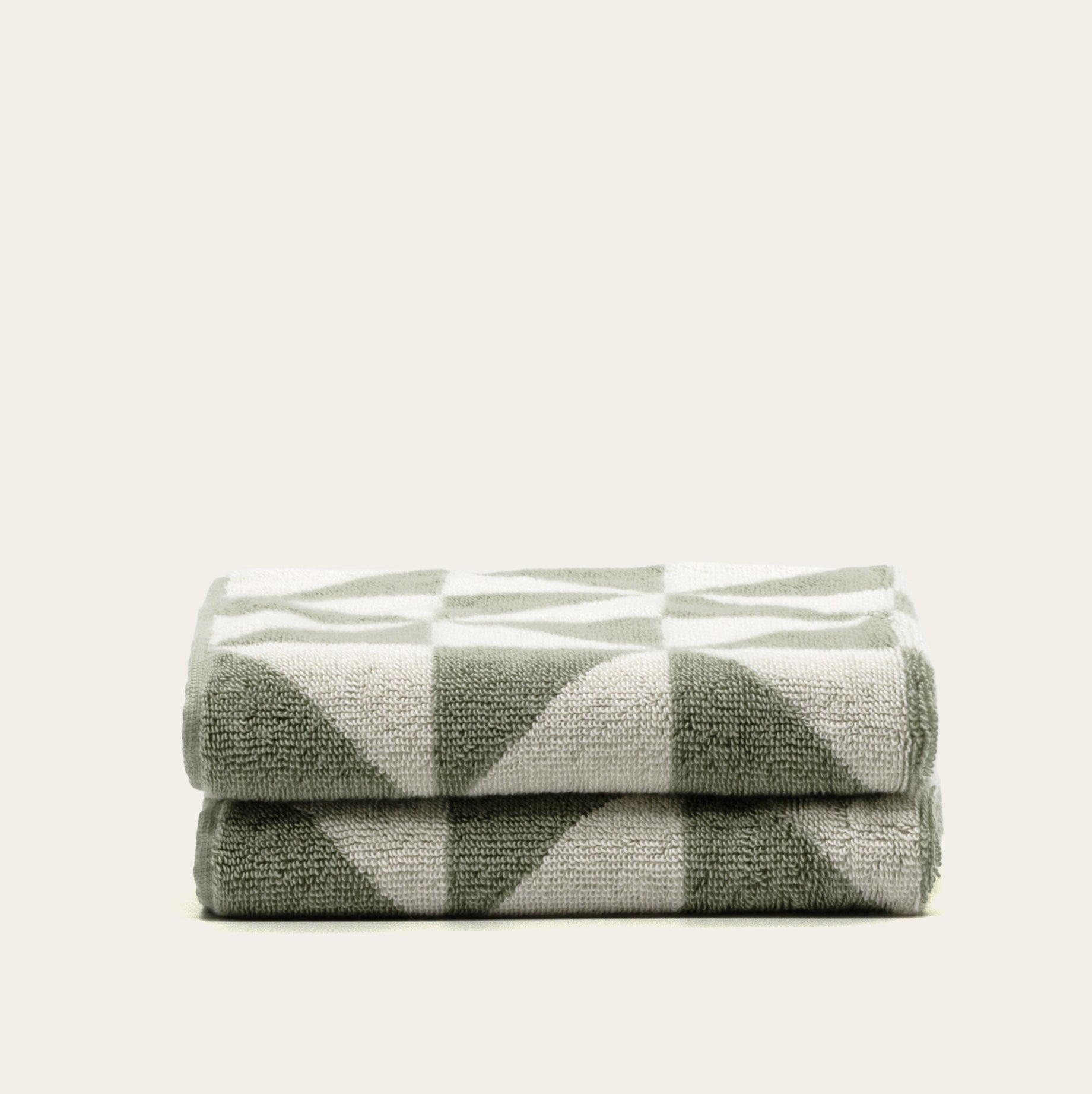 Set of two Italic Umbra Australian cotton bath washcloths in sage and ecru, soft and absorbent for home bath use.