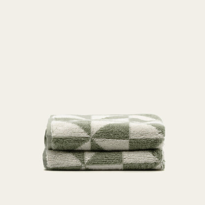 Set of two Italic Umbra Australian Cotton Bath Towels in sage and ecru, soft and plush for home bath use.