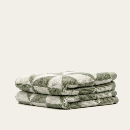 Set of two Italic Umbra Australian Cotton bath washcloths in sage and ecru color, soft and absorbent home bath towels.