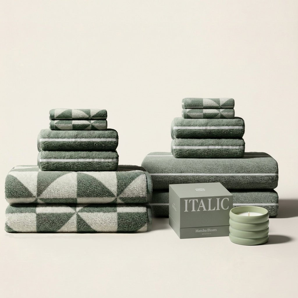 Set of two Italic Umbra Australian Cotton Bath Towels in sage and ecru, soft and plush for home use.