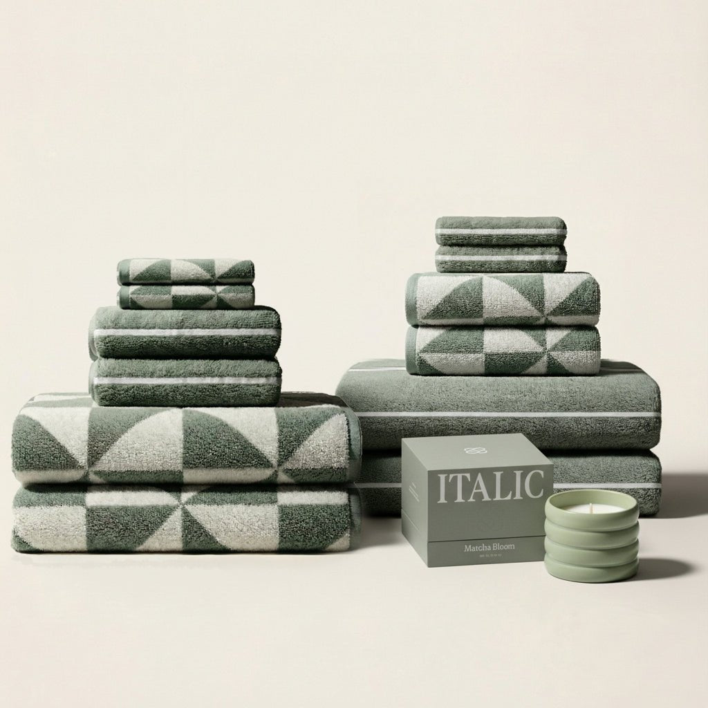 Set of two Italic Umbra Australian Cotton Bath Towels in sage and ecru, soft and plush for home use.