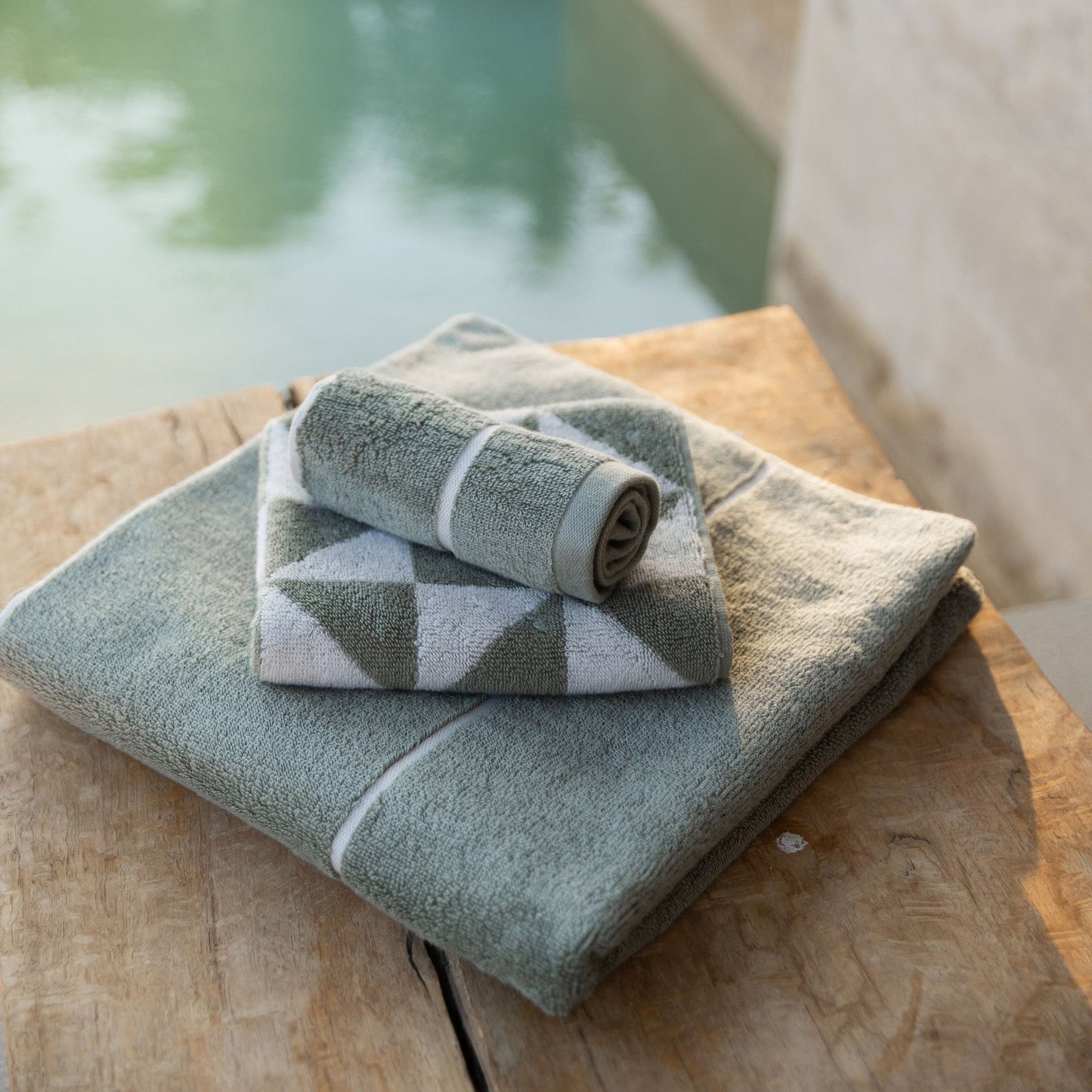 Set of two Italic Umbra Australian Cotton Bath Towels in sage and ecru, soft and plush for home use.