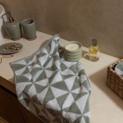 Set of two Italic Umbra Australian Cotton bath towels in sage and ecru, soft and absorbent for home bath use.