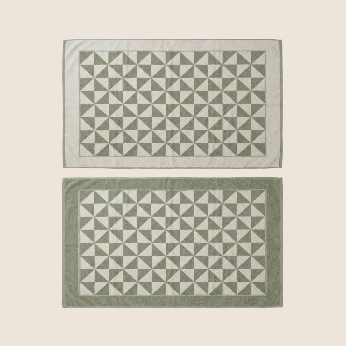 Set of two Italic Umbra Australian cotton bath towels in sage and ecru, soft and plush for home use.
