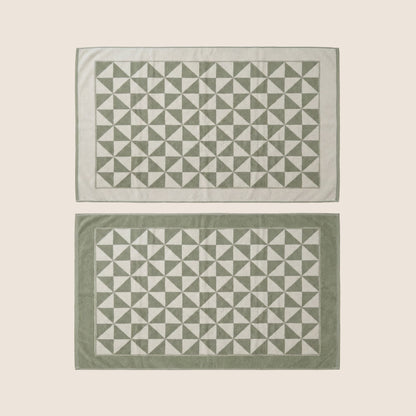 Set of two Italic Umbra Australian cotton bath towels in sage and ecru, soft and plush for home use.