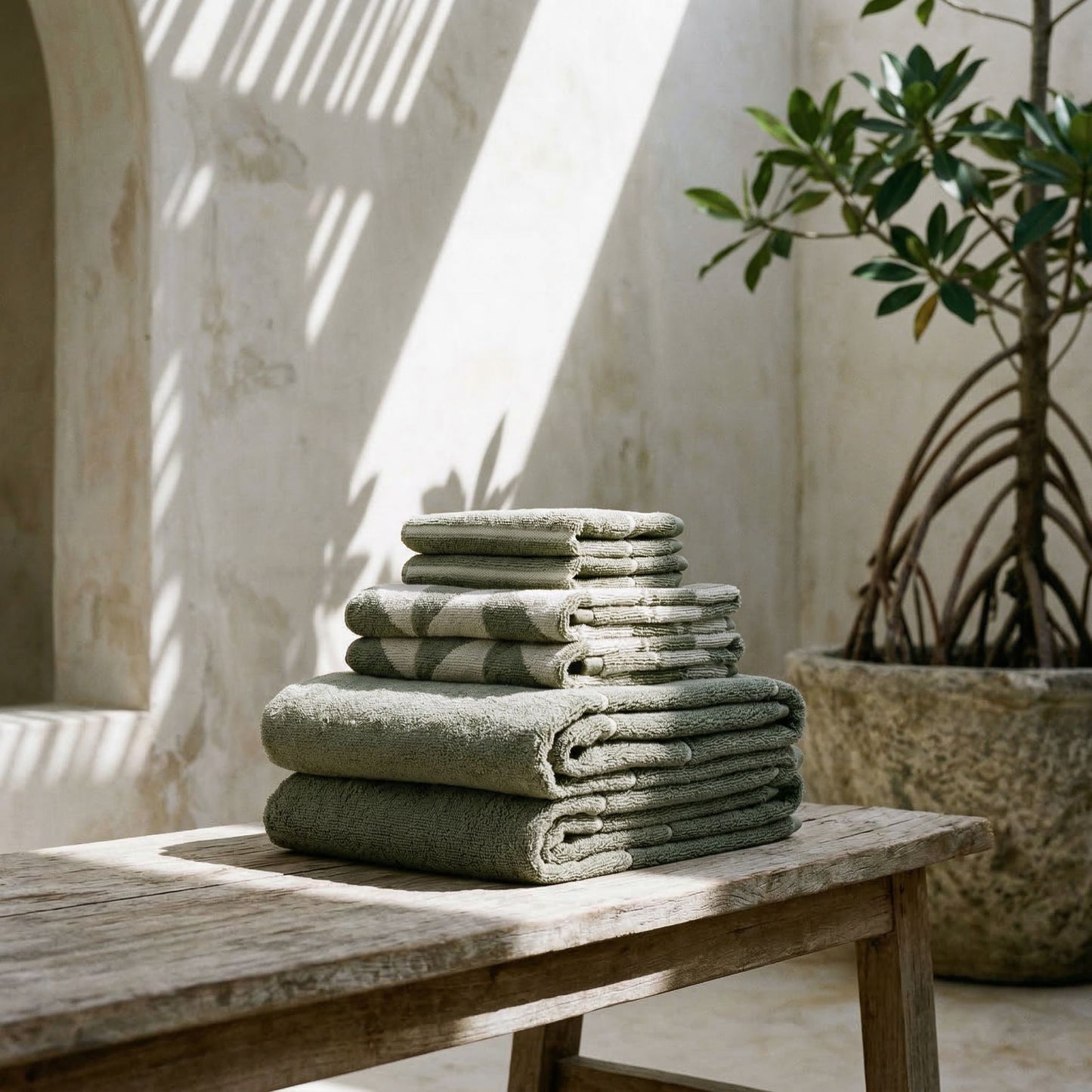 Set of two Italic Umbra Australian cotton bath washcloths in sage and ecru, soft and absorbent for home bath use.