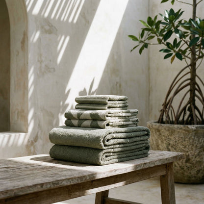 Set of two Italic Umbra Australian cotton bath washcloths in sage and ecru, soft and absorbent for home bath use.