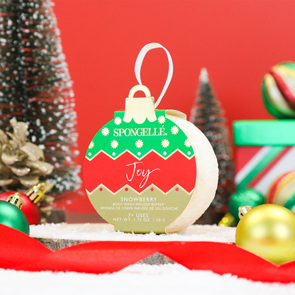 Spongellé Joy Snowberry holiday ornament body wash infused buffer with festive holiday design and textured surface for skincare.