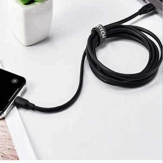 CHOETECH 2m black USB-C to Lightning cable connected to phone on desk