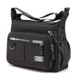 Black KAIGUANG Oxford shoulder bag with large capacity, multi-layer pockets, casual design, and single shoulder crossbody style.