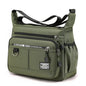 Black KAIGUANG Yummy Mummy Bag large capacity Oxford shoulder bag with multi-layer pockets and casual crossbody design for men.