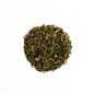 Premium Organic Himalayan Mist Kanchanjangha Verde green tea from Nepal Tea, showcasing fresh green tea leaves in a natural setting.