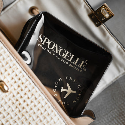 Black Spongellé travel case with zipper closure, compact and sturdy design for storing toiletries and travel essentials.