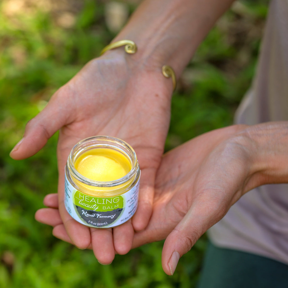 Kauai Farmacy Healing Beauty Balm salve in a 2oz jar, showcasing the natural healing skincare product with botanical ingredients.