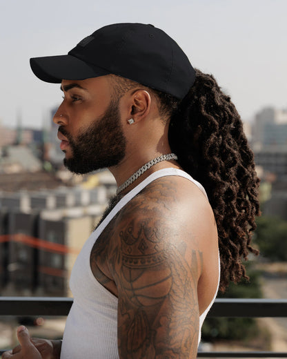 Black waterproof satin-lined dad hat by KINApparel, featuring a classic design and sturdy waterproof fabric.