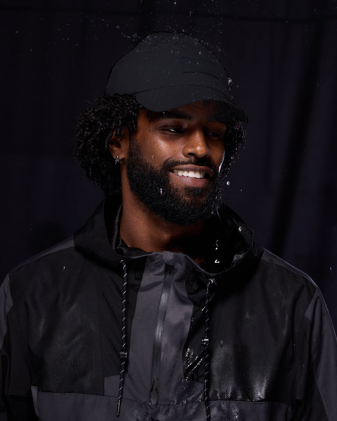 Black waterproof satin-lined dad hat by KINApparel, showcasing a casual style with a smooth satin interior and waterproof fabric.