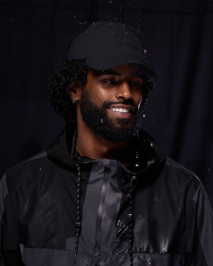 Black waterproof satin-lined dad hat by KINApparel, showcasing a casual style with a smooth satin interior and waterproof fabric.