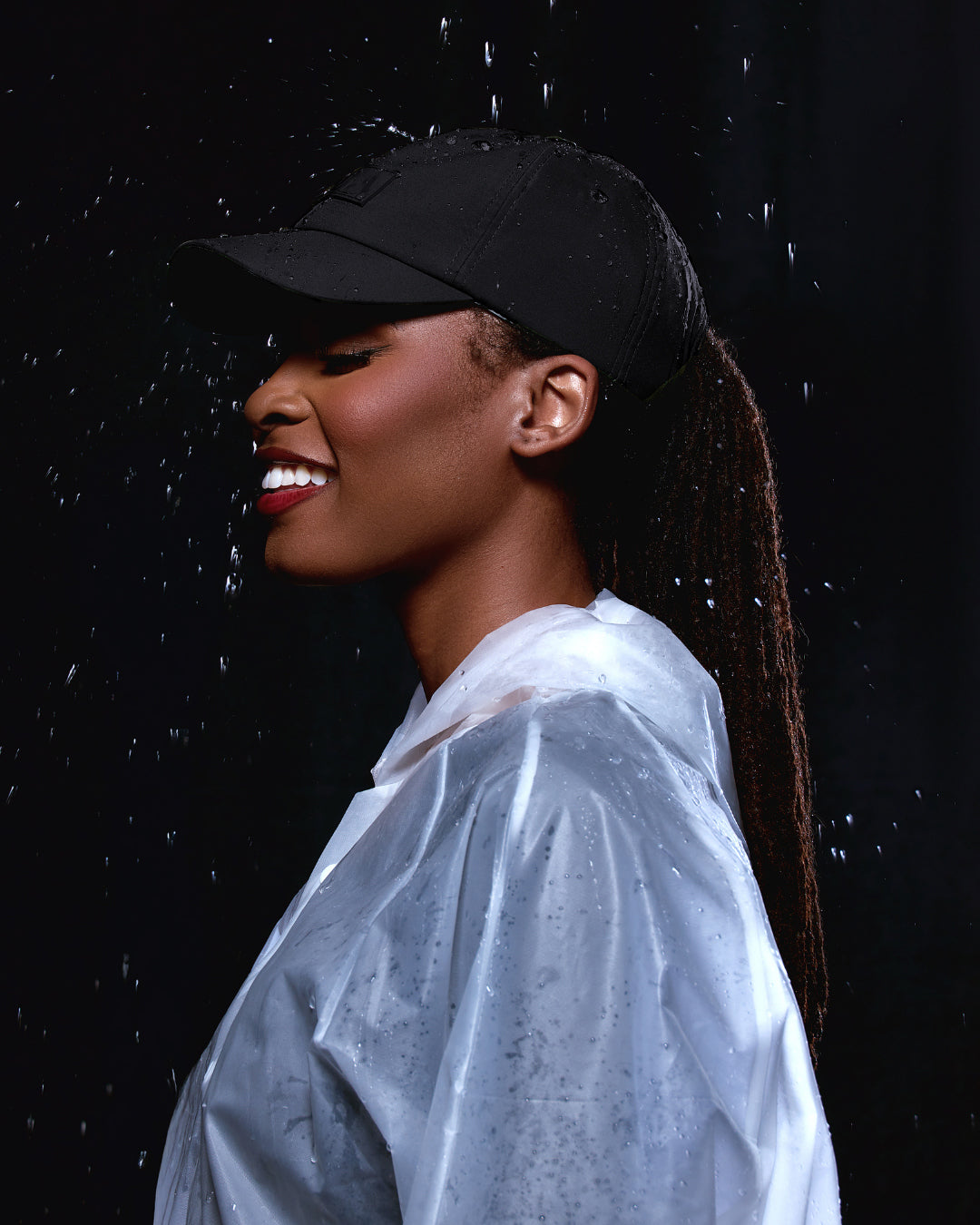 Black waterproof satin-lined dad hat by KINApparel, featuring a classic design and adjustable strap for a comfortable fit.