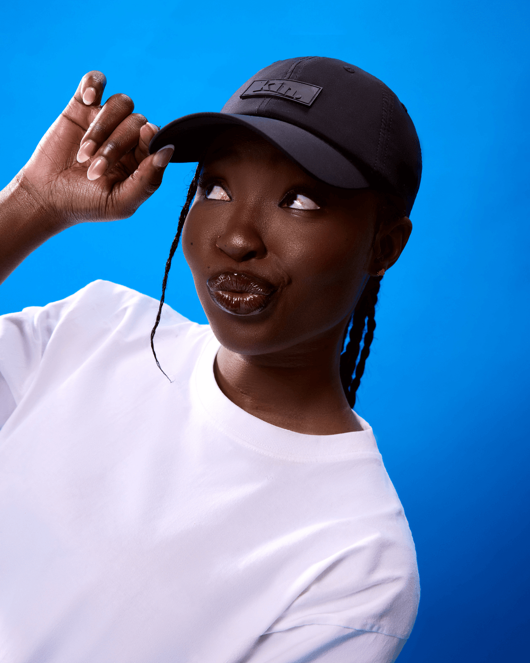 Black waterproof satin-lined dad hat by KINApparel, featuring a casual design with a curved brim and adjustable strap.
