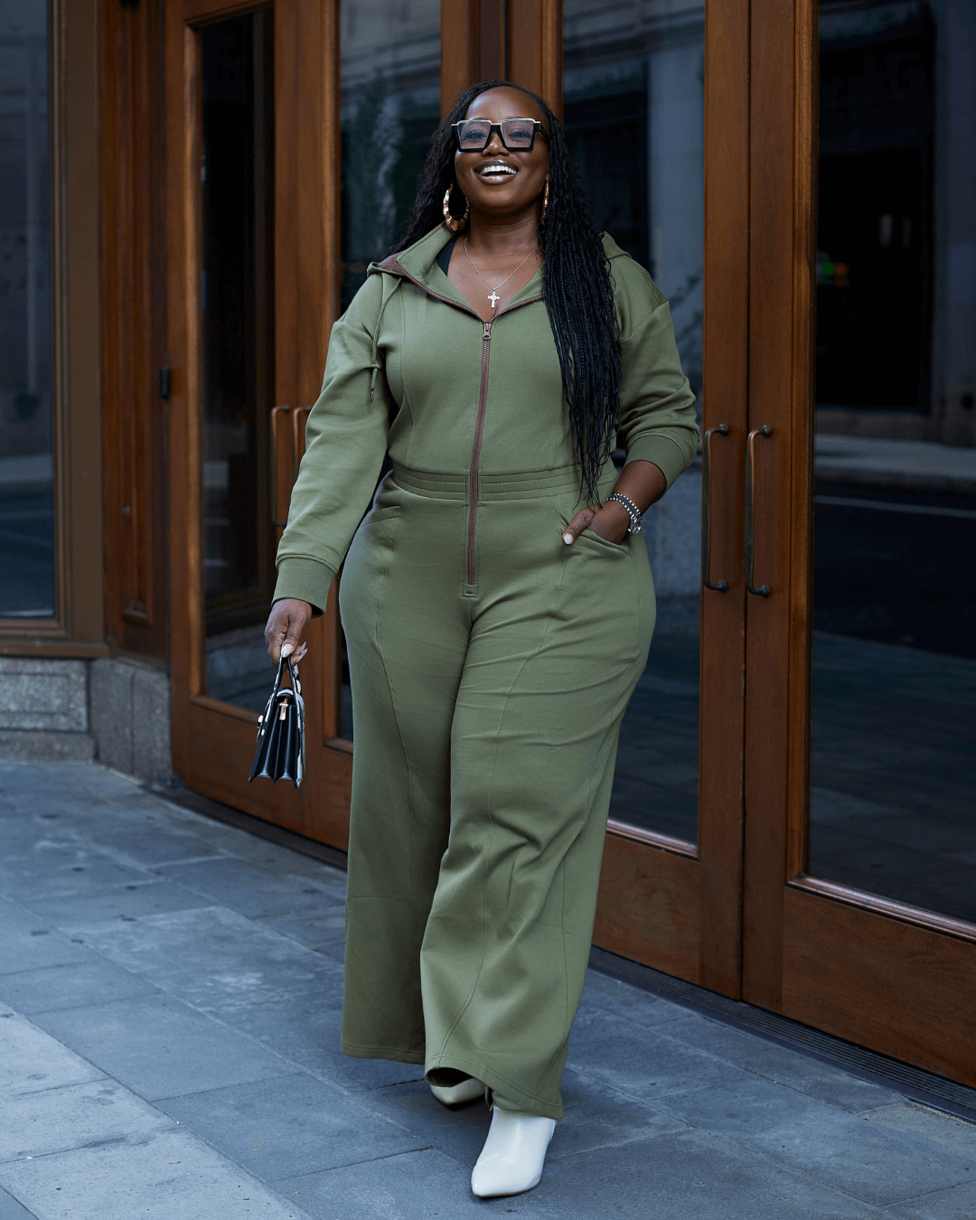 Green satin-lined jumpsuit by KINApparel, featuring a sleek design and comfortable fit, shown in a regular XS size.