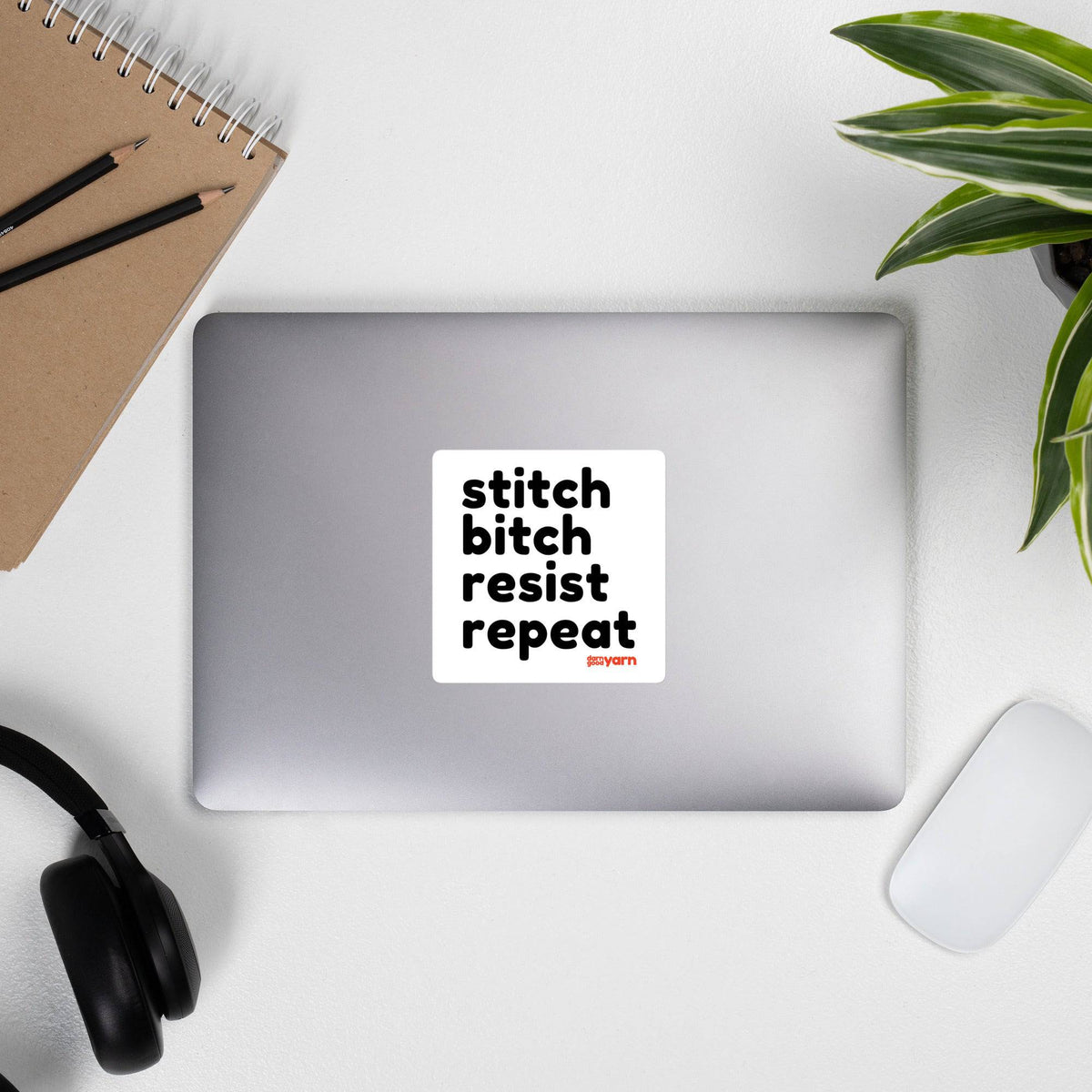 White Stitch Bitch Resist Repeat bubble-free 4-inch square sticker by Darn Good Yarn, shown on a lifestyle background.