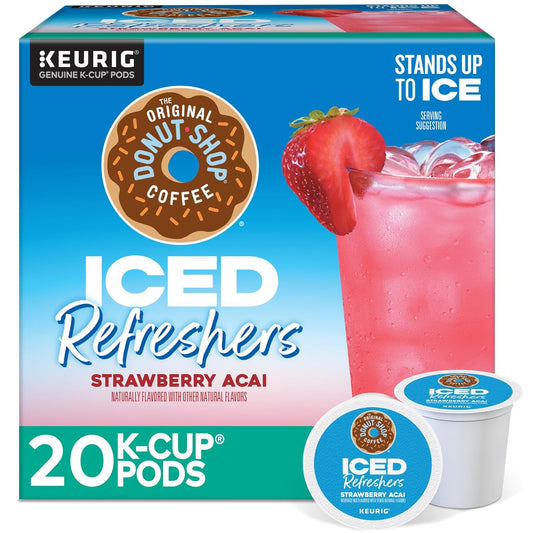 KupofK Coffee The Original Donut Shop Iced Refreshers Strawberry Acai flavor in a clear glass, showcasing the vibrant pink drink with ice.