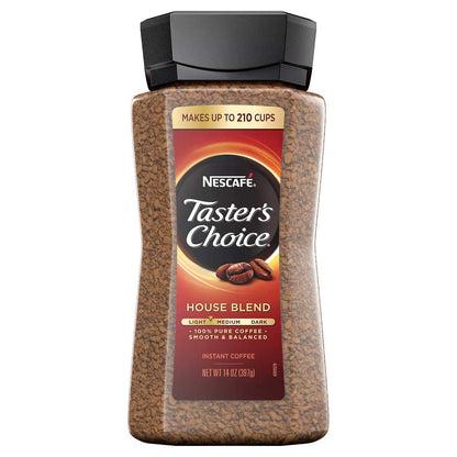 Cup of KupofK Coffee Nescafe Taster's Choice instant coffee with a spoon on a white background.
