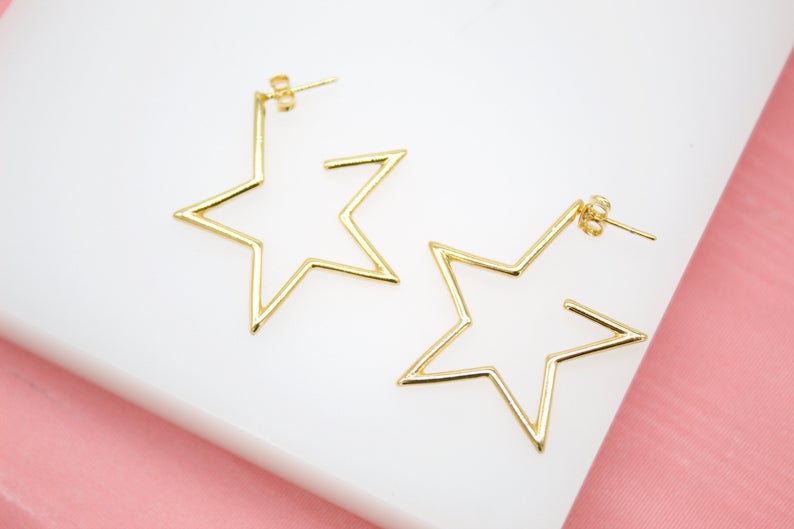 Large 18K gold-filled open star hoop earrings by MIA Jewelry, modern minimalist design with sleek, stylish metal hoops.