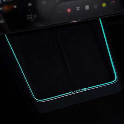 Laser-carved Tesery ambient light for Model Y Juniper with wireless charging port, showcasing sleek illuminated interior accent.