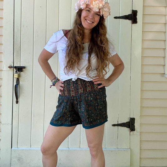 Darn Good Yarn Laurel Canyon Lounge Shorts in eco-friendly crochet knit, boho style, plus size womens clothing laid flat.