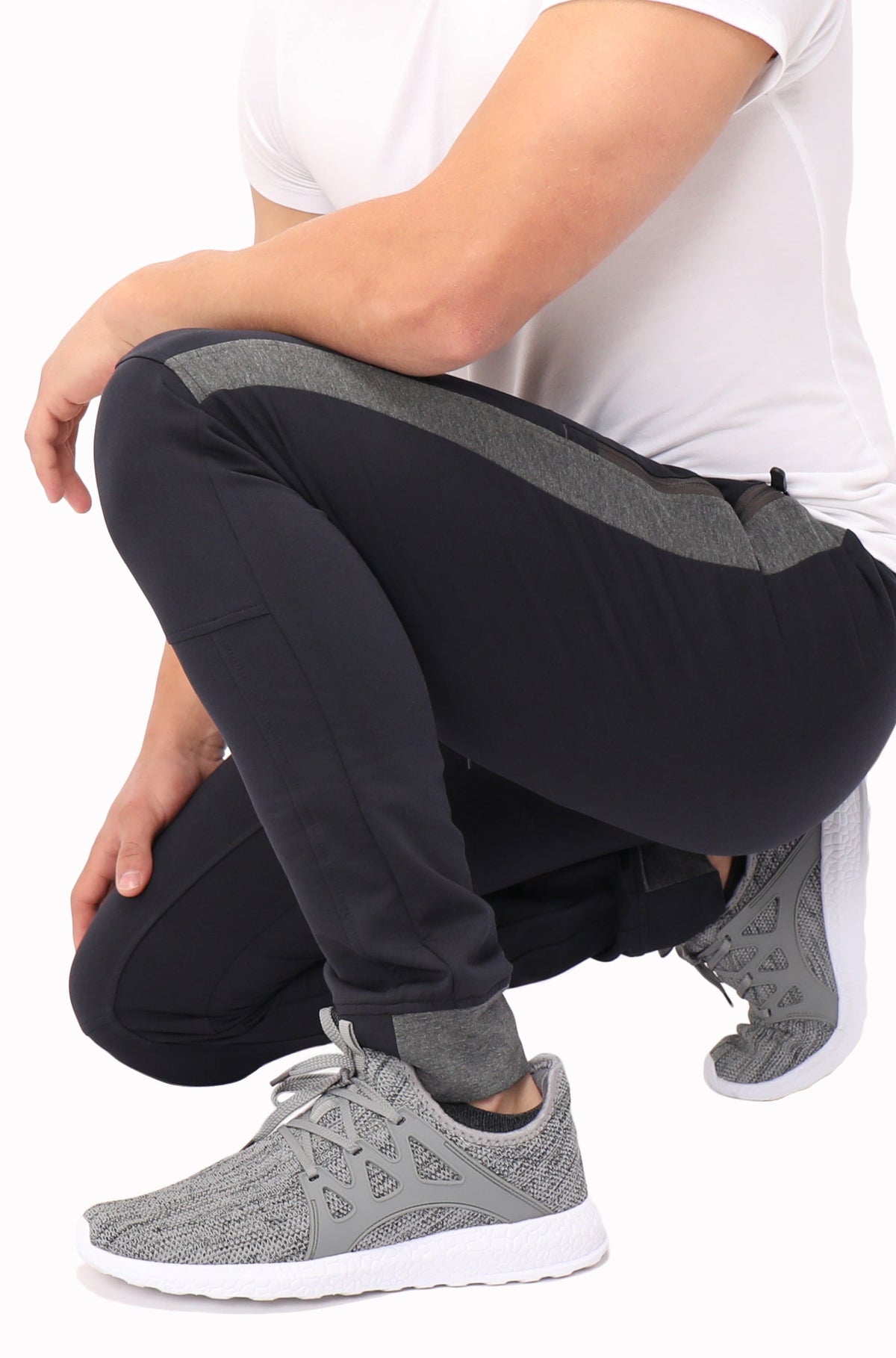 Close-up of SCR Sportswear Infinite Flex Tall Fit men's joggers sweatpants leg showing soft knit fabric and tapered fit detail.