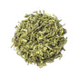 Organic Lemongrass Green Tea blend from Nepal Tea, showing fresh lemongrass and green tea leaves in a natural setting.