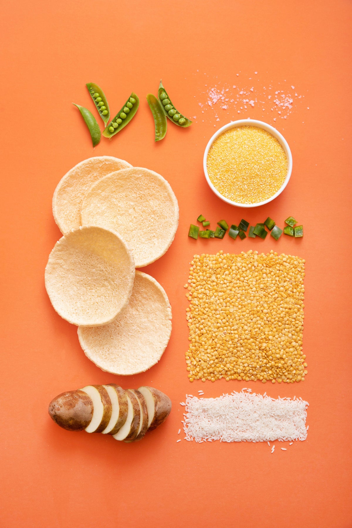 Kim's Magic Pop Lentil Pop snack in a colorful package, showcasing crispy, golden lentil chips from Delice Products.
