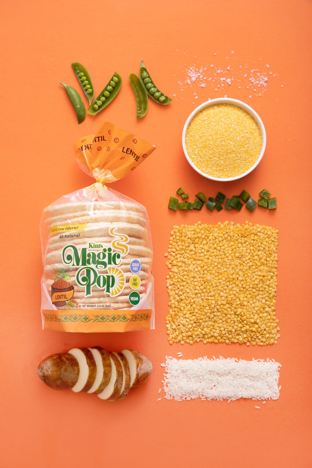 Kim's Magic Pop Lentil Pop snack in a transparent bag showing crispy lentil chips on a white background